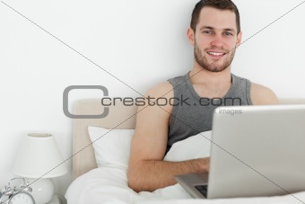 Handsome man using a laptop