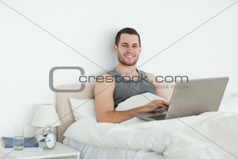 Serene man using a laptop