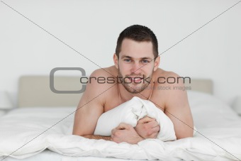 Man lying on his bed