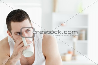 Close up of a young man having coffee