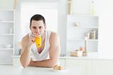 Man drinking orange juice