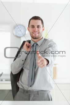 Portrait of a businessman with the thumb up