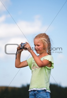 Little girl with photo camera