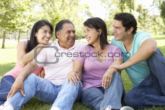 Grandparents With Adult Children In Park