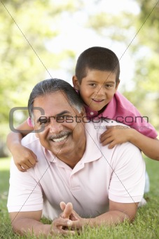 Grandfather With Grandson In Park