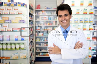 portrait of a male pharmacist at pharmacy