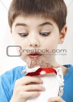 Surprised boy with chocolate