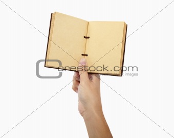 hand holding book and isolated on white