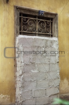 vintage door blocked by concrete blocks
