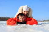 Portrait of young couple having fun on frozen river