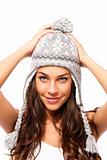 sweet young brunette woman wearing winter cap