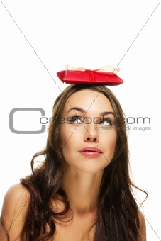 young woman looking to the present on her head