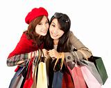 happy asian girls holding shopping bag