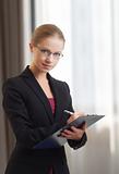 beautiful young business woman with folder