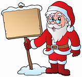 Santa Claus holding wooden board