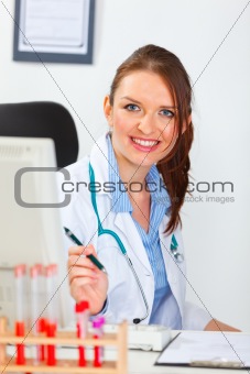 Portrait of smiling female medical doctor at office
