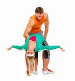 Fit young female and guy in sportswear having fun isolated on white
