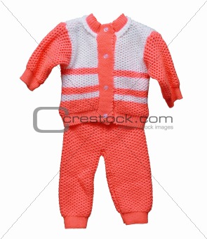 Knitted wool overalls for baby on white