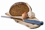 brown bread on shelf with onion and garlic