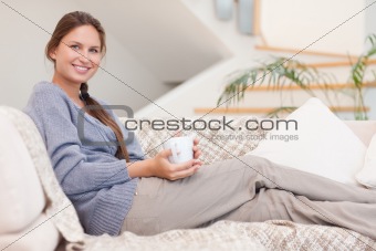 Beautiful woman holding a cup of tea