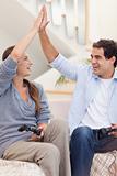 Portrait of a cheerful couple playing video games
