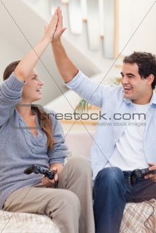 Portrait of a cheerful couple playing video games