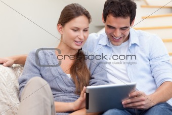 Couple using a tablet computer