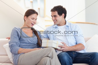 Man offering a gift to his fiance