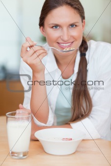 Portrait of a cute woman having breakfast