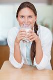Portrait of a woman drinking milk