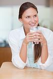 Portrait of a calm woman drinking milk