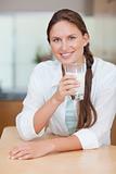 Portrait of a healthy woman drinking milk