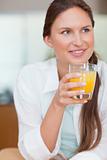 Portrait of a happy woman drinking juice