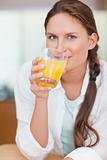 Portrait of a beautiful woman drinking juice