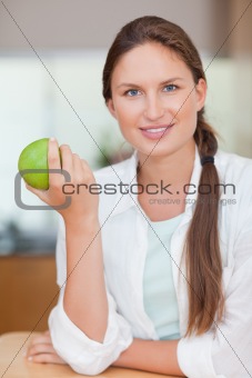 Portrait of a woman with an apple