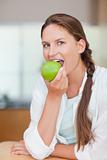 Portrait of a woman eating an apple