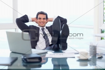 Happy businessman relaxing