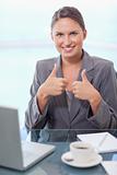 Portrait of a businesswoman with the thumbs up