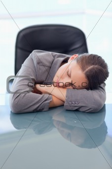 Portrait of a tired businesswoman sleeping