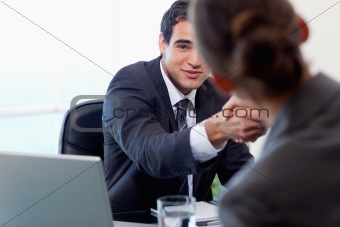 Satisfied manager interviewing a female applicant
