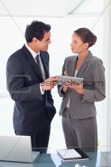 Business partner standing with tablet in their hands
