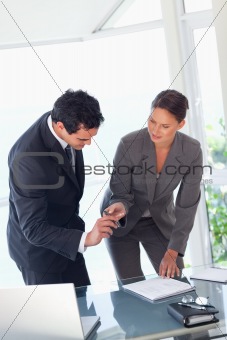 Businesswoman providing pen to sign contract