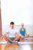 Healthy couple at yoga class
