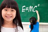 happy girls  by chalkboard with e=mc2