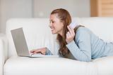 Cheerful smiling woman shopping online