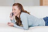 Young woman laughing on the phone