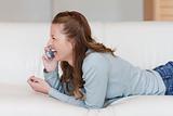 Young female laughing over the phone