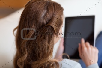 Above view of woman typing on her tablet