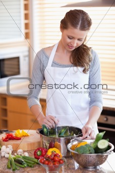 Woman stirring her soup 