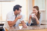 Couple having some coffee in the kitchen